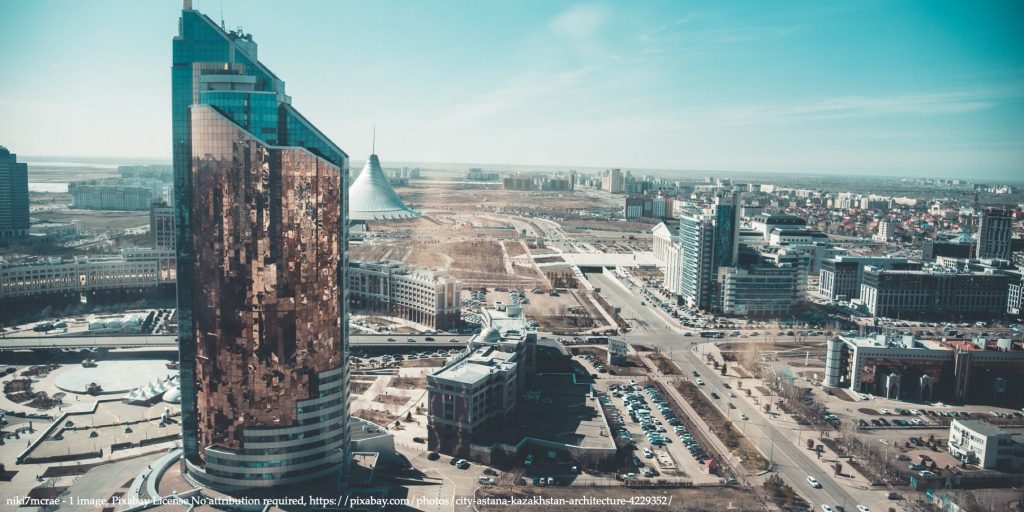 Image of Kazakhstan with skyscraper in the middle of the capital city representing oil price