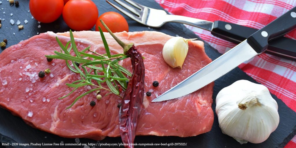 A picture of meat on the table table, indoor, sitting representing Informational campaigns that affect meat consumption