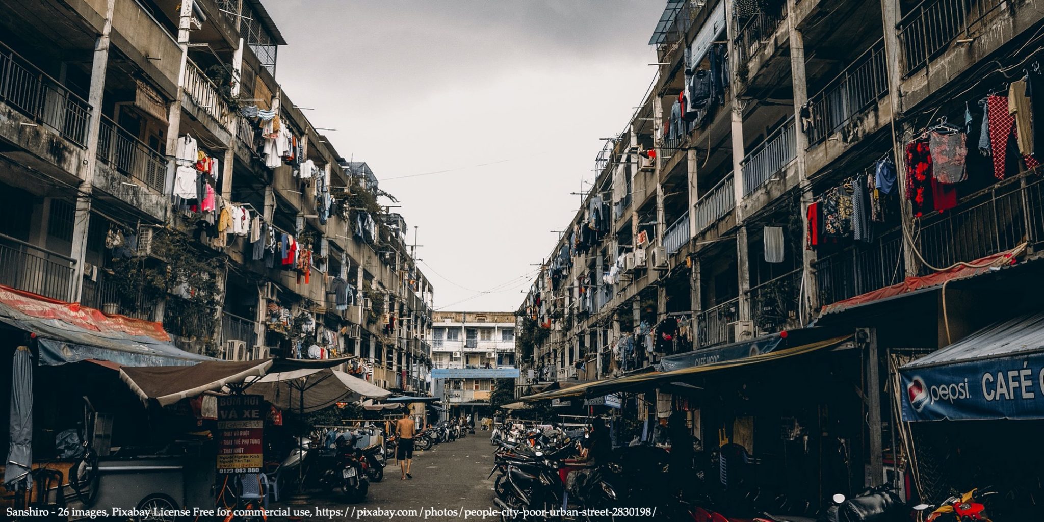 An image of narrow street in slum representing Covid-19 in LDCs