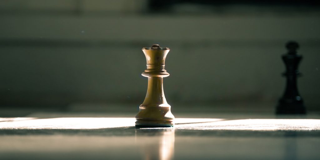 Image with chess figure placed in the middle of the table representing gender economics