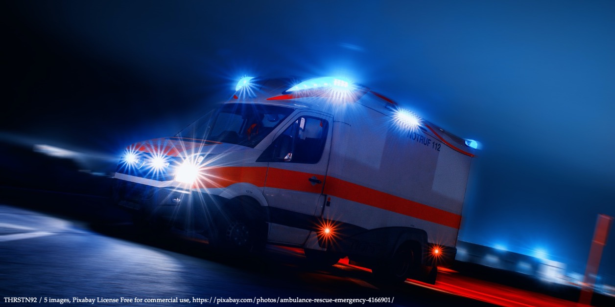 An image with ambulance car at night representing COVID-19 Health Risks and Healthcare Resources