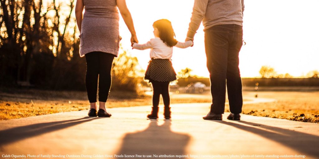 Family in the golden hour representing Child Benefits