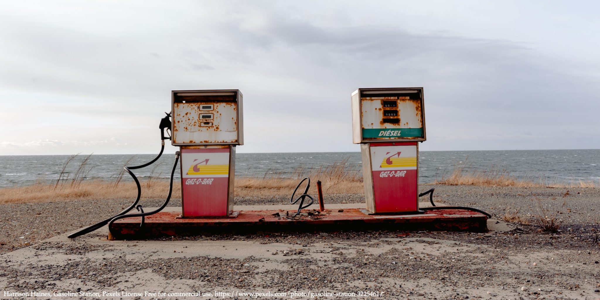 Two abandoned gas tanks representing fossil fuel taxation