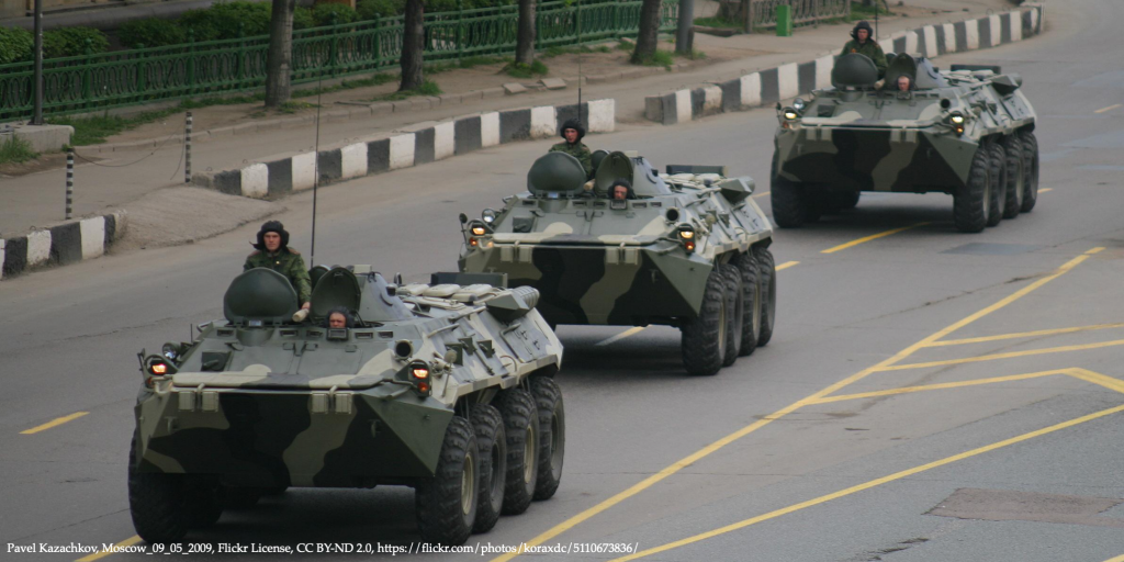 Russian soldiers in military truck convoy representing conflict between Russia and Ukraine