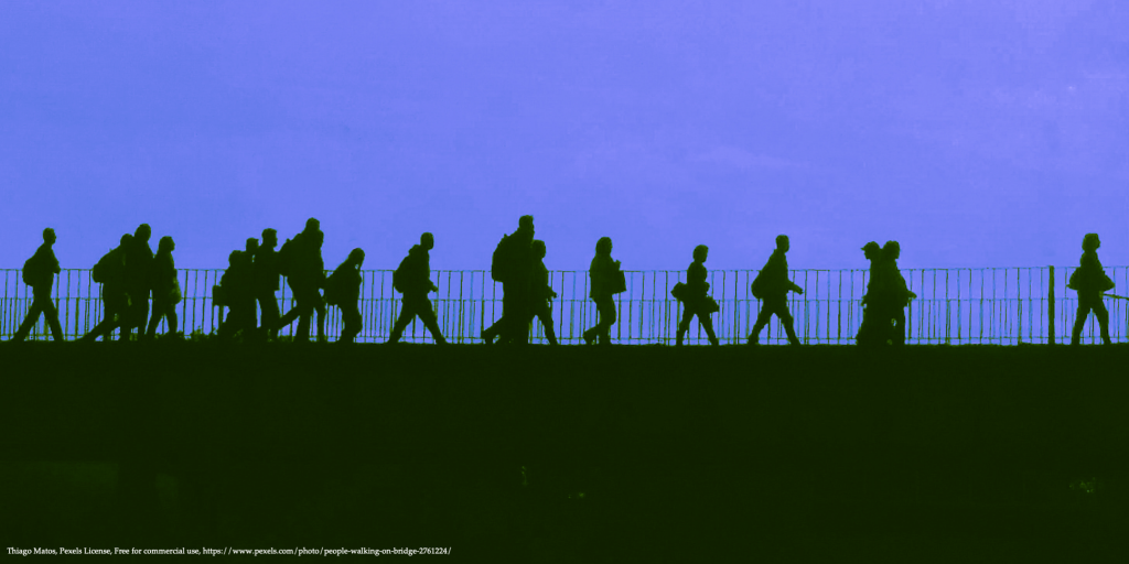 silhouettes of walking people representing forced migration