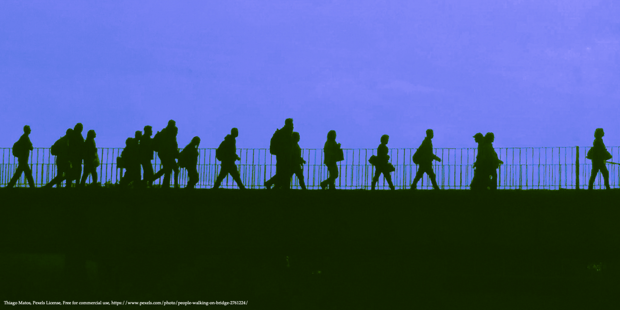 silhouettes of walking people representing forced migration