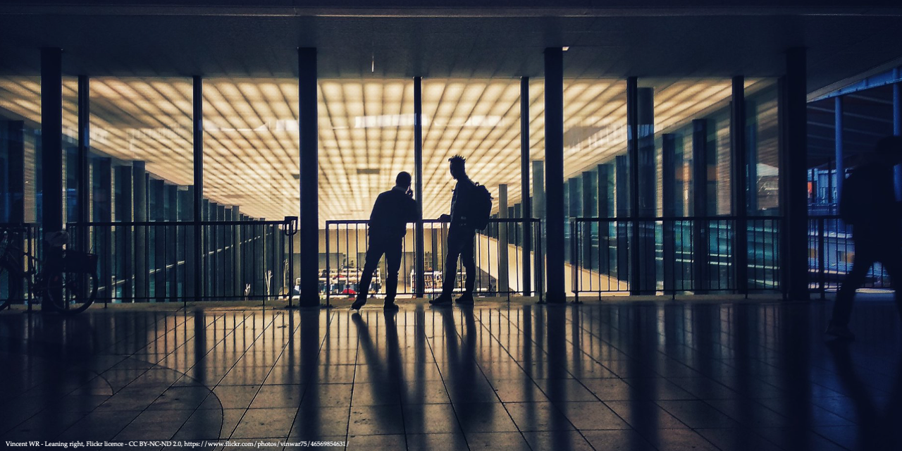 Image of dark university area with two men representing women underrepresented in academia