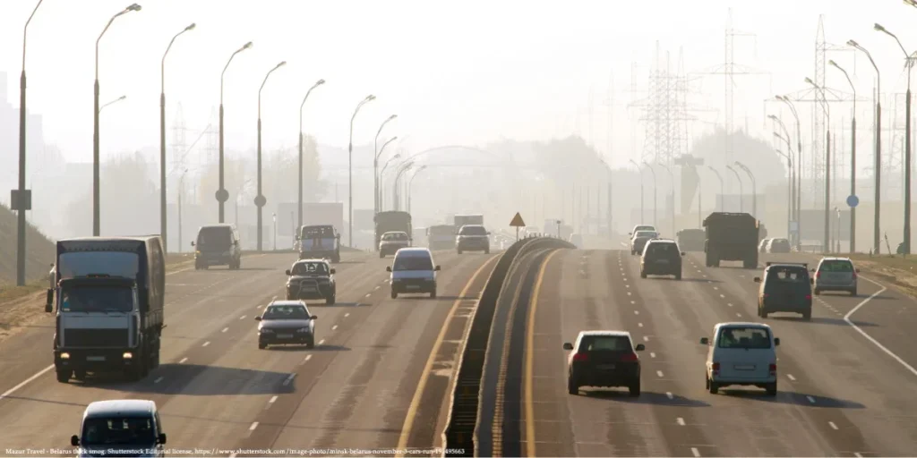 Traffic under smog in Belarus reflecting environmental pollution and decline